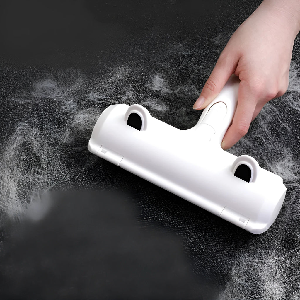 White reusable pet hair remover roller on fabric furniture