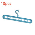 Green nine-hole plastic folding hanger with trousers organised vertically