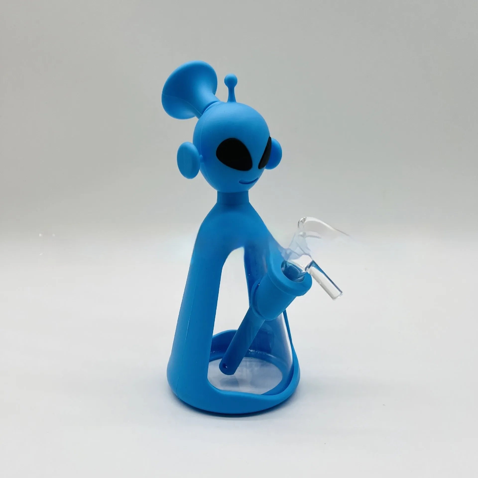 Glass silicone cigarette pipe with clear bowl and blue silicone mouthpiece on white background