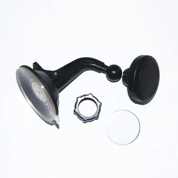 Black magnetic car phone holder mounted on a car dashboard, showing a smartphone attached.