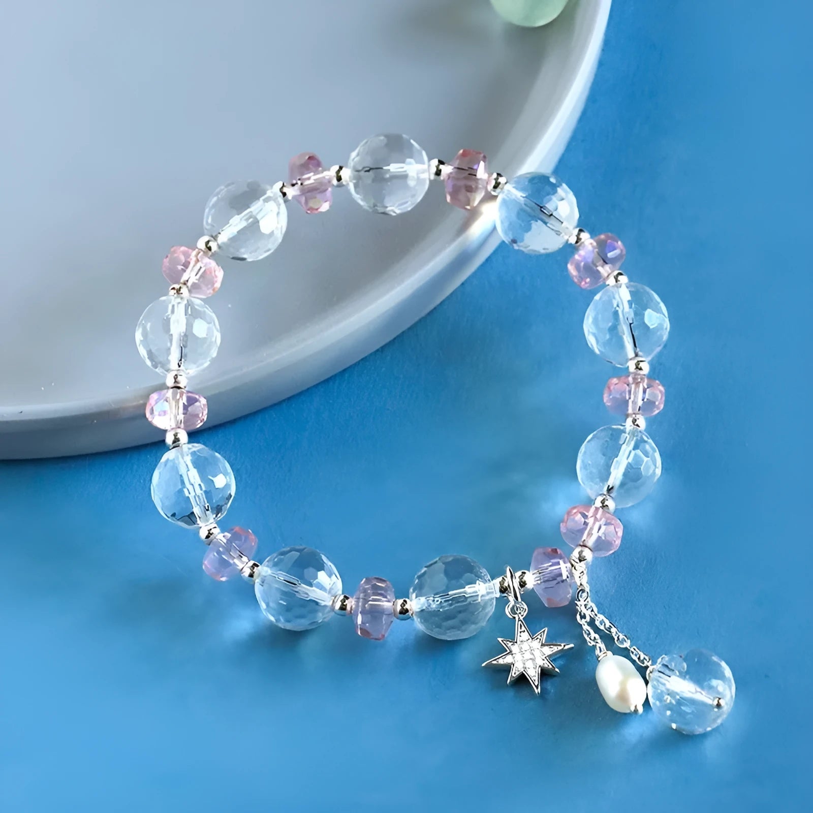 Women's white crystal bracelet with lucky cat charm and diamond-shaped stones on adjustable electroplated band