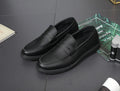 Men's black Korean retro slip-on driving shoes with microfiber upper and stitched detailing on white background