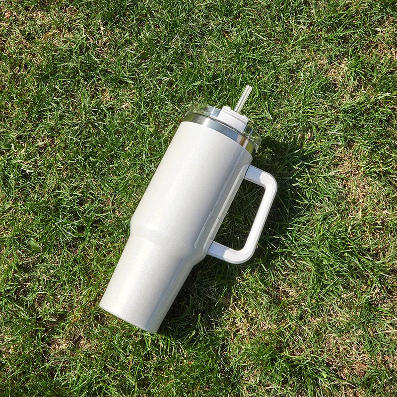 Stainless steel vacuum insulation cup in rainbow gradient colours showing double-layer construction