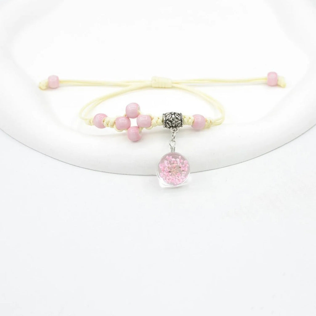Glass dried flower bracelet with real preserved flowers in colourful beads, hand-woven construction