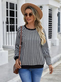 Black polyester pullover sweater with a plaid and printed stripe pattern, long sleeves.