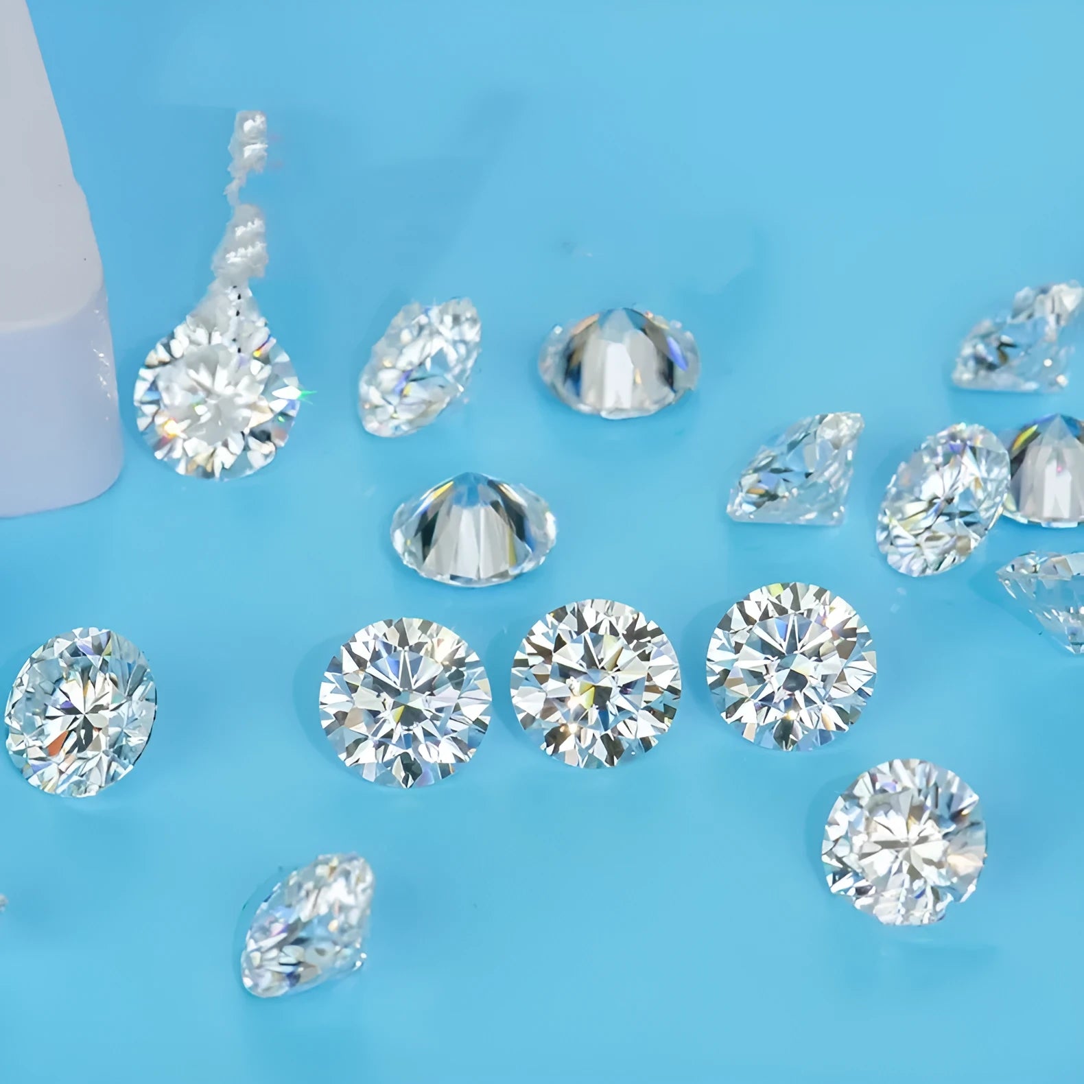 Round moissanite gem stone with eight hearts and eight arrows cut, showing polished surface