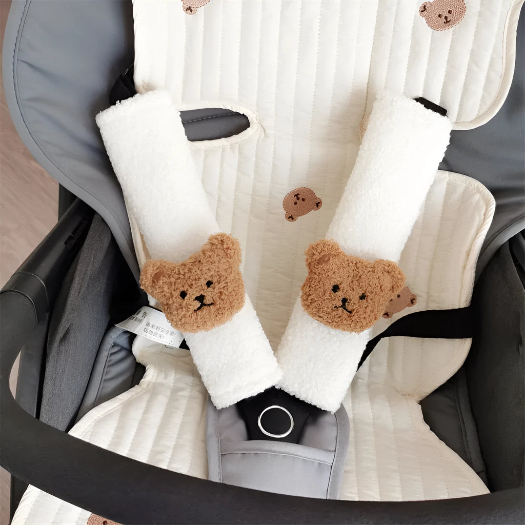Cartoon bear plush seat belt cover for baby car seats showing khaki and coffee colour options