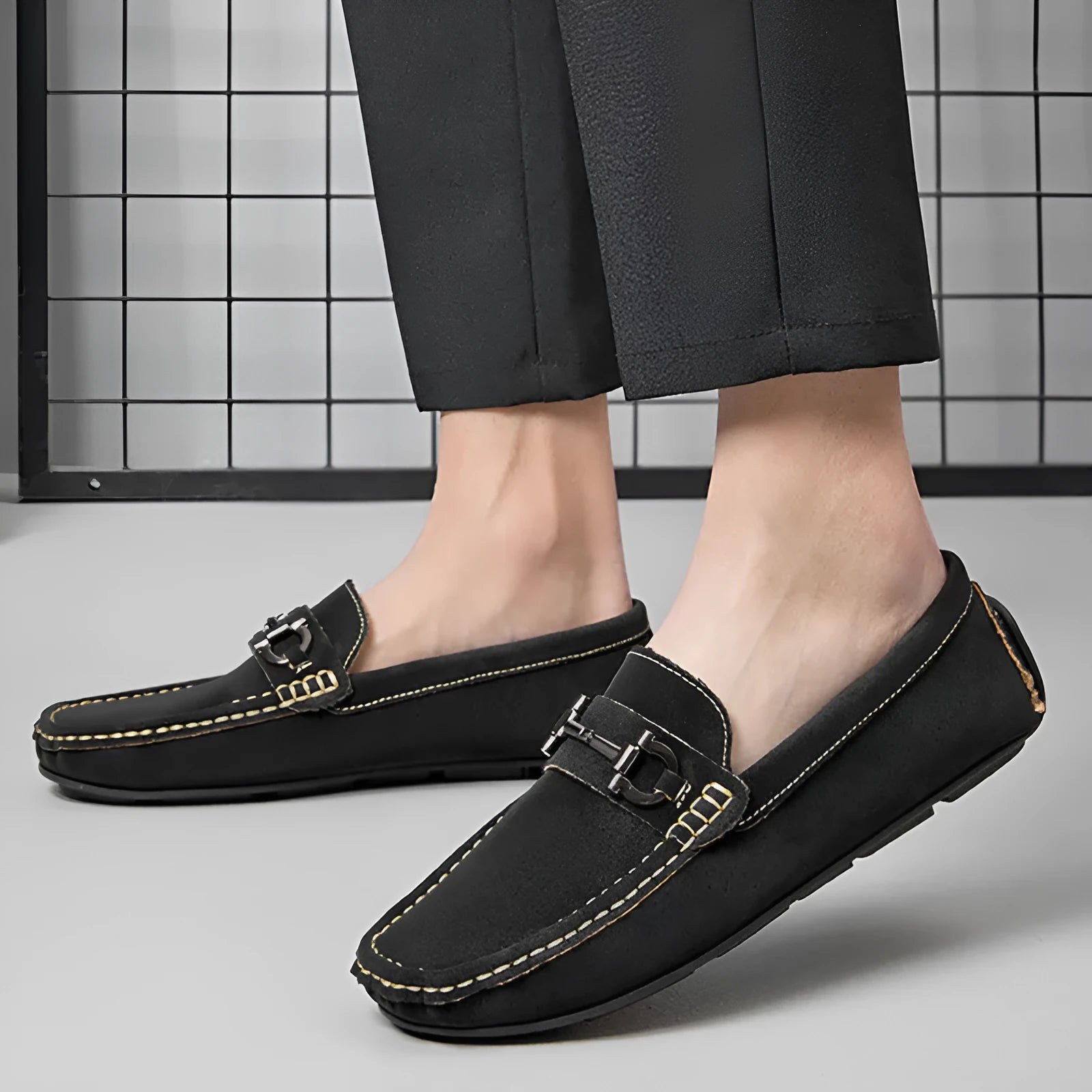 Men's beige leather casual loafers with a round toe and rubber sole.
