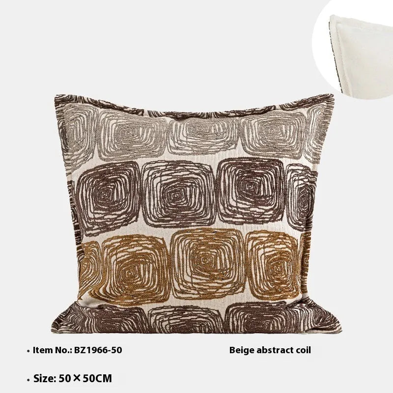 Cream and coffee coloured abstract coil pattern square and rectangular polyester cushion covers.