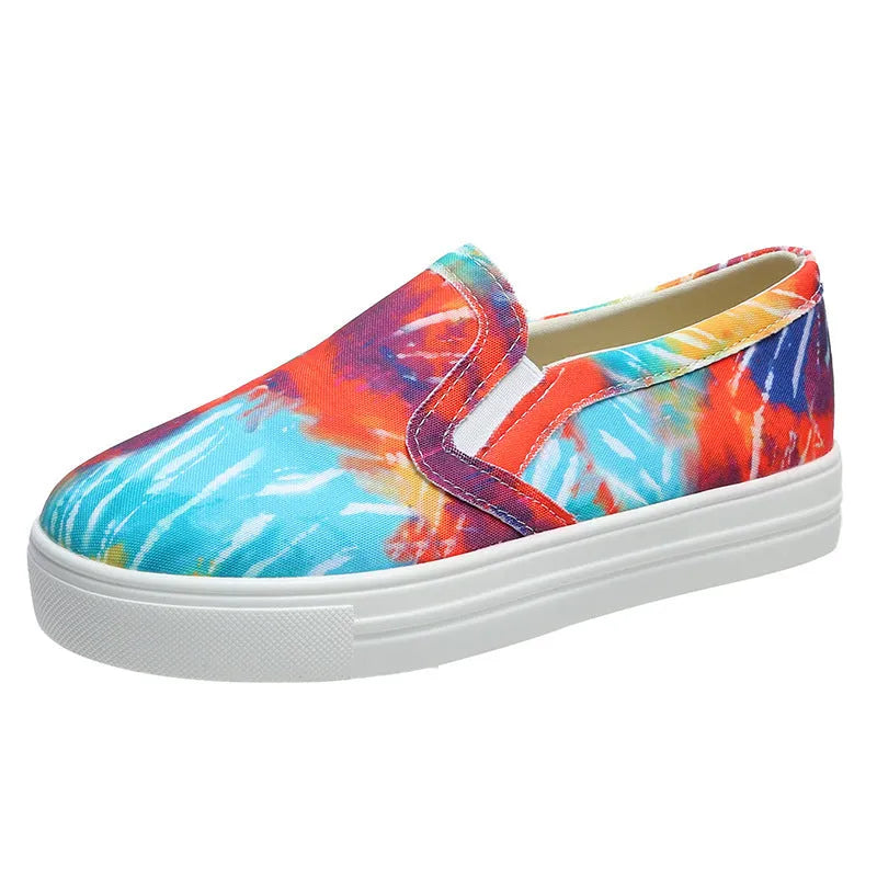 Women's low-top casual canvas shoes in multiple colours with a flat rubber sole.
