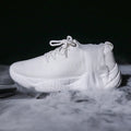 Women's white thick-soled casual shoes with woven upper and front strap.