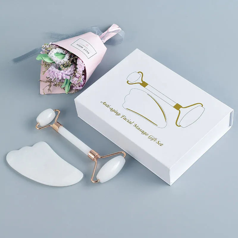 White jade double-headed roller and scraping board set for facial and body massage.