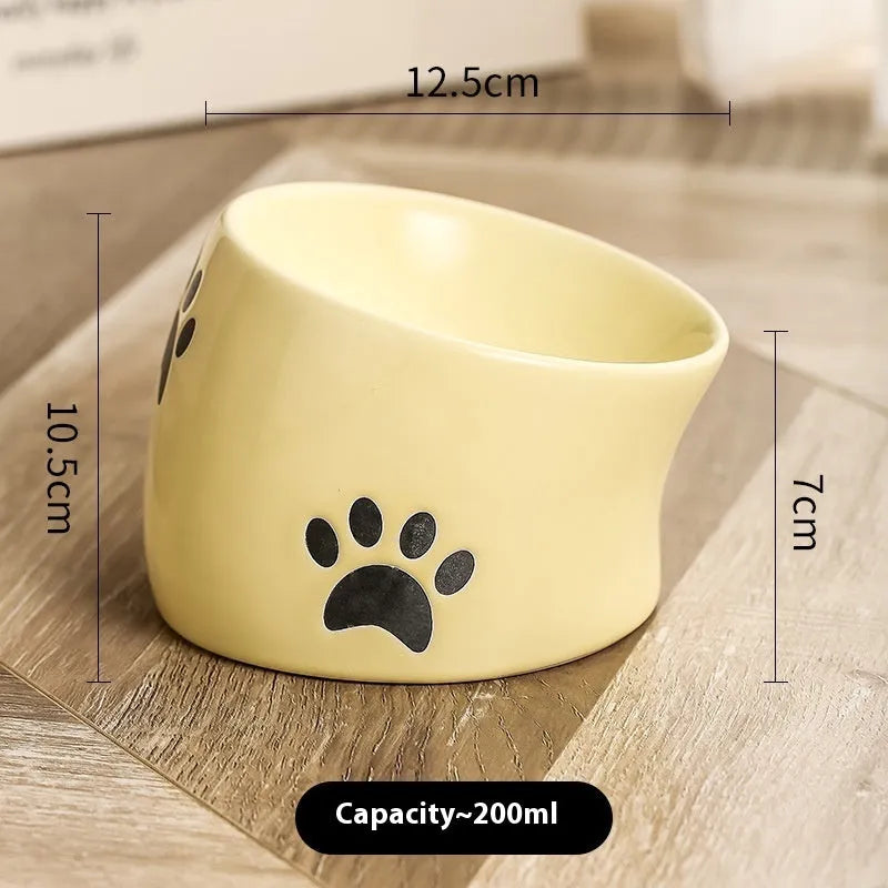 Ceramic cat bowl with high-footed design showing cat's paw decoration pattern in selected colour