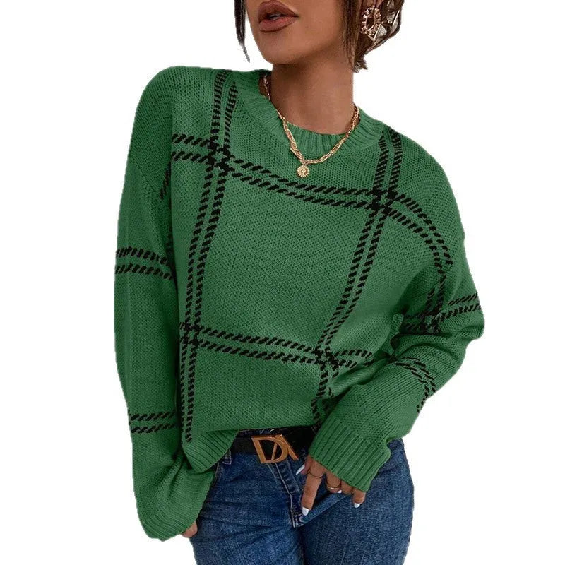 Women's loose fit plaid sweater with apricot, black, beige, red, and green colour-block stripes.