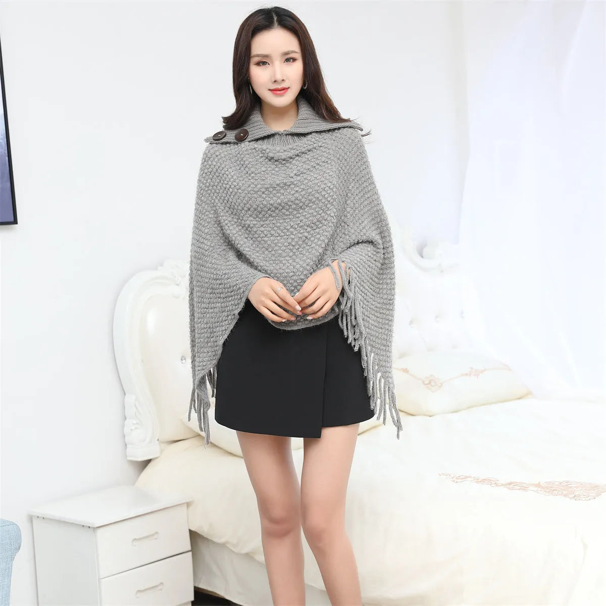 Sleeveless acrylic fibre cloak shawl in free size with dot pattern, shown in one of eight colour options
