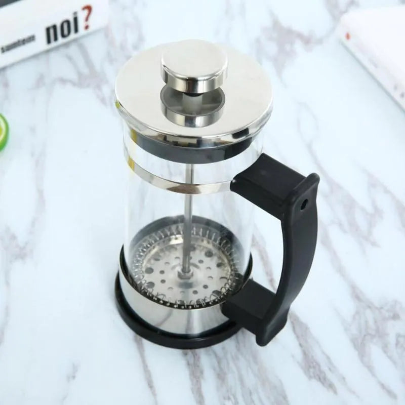 Glass and stainless steel manual coffee maker with 350ml capacity measuring 10cm wide by 8cm deep by 17cm tall