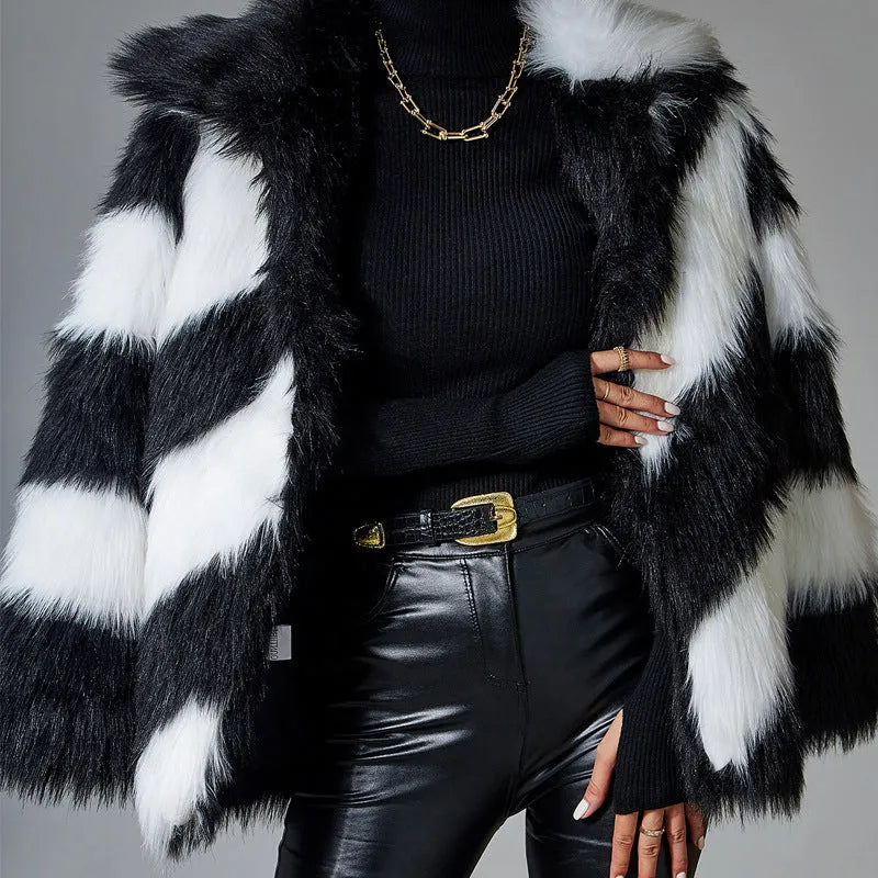 Minimalist faux fur coat with a contrasting colour lapel and a fur collar.