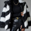Minimalist faux fur coat with a contrasting colour lapel and a fur collar.