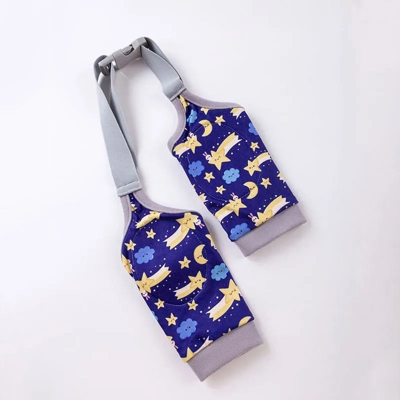 Dog wearing blue knee protector pad with elbow padding and matching scarf with doggie print pattern