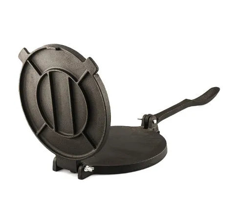 Round cast iron hand pressure cake press on a kitchen surface, available in sizes 16.5cm to 26cm diameter