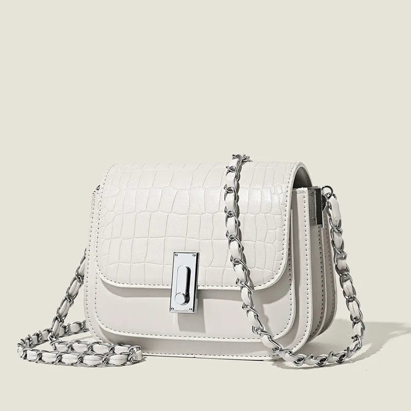 Soft PU women's fashion shoulder bag in horizontal square shape with phone compartment.