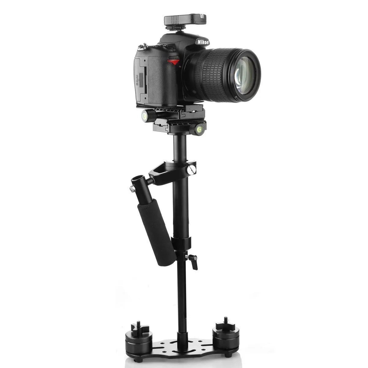 Black aluminium handheld camera stabilizer with adjustable height on a table.