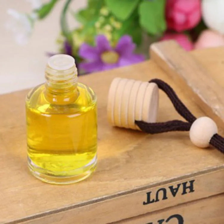 Glass bottle car air freshener hanging ornament with six fragrance options including lavender, lemon and apple scents