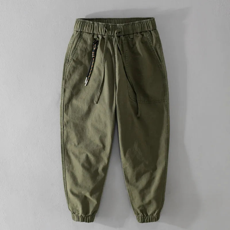 Man wearing Amekaji-style casual overalls with ankle banding in Army Green colour.