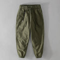 Man wearing Amekaji-style casual overalls with ankle banding in Army Green colour.