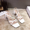 Women's thick heel Roman sandals in white colour showing backless design and side cutouts