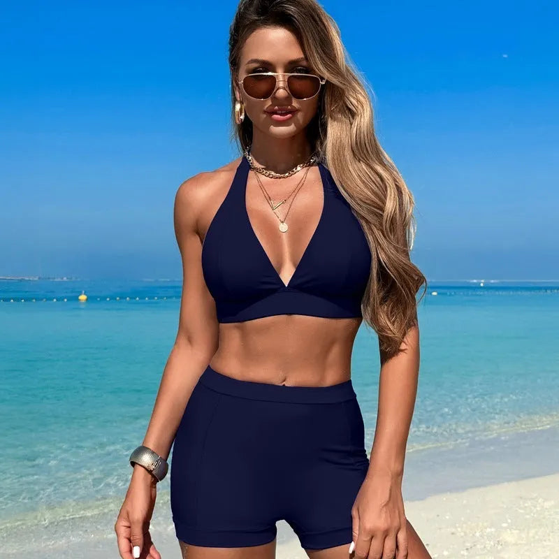 Women's black split bikini swimsuit made from nylon, shown front view.