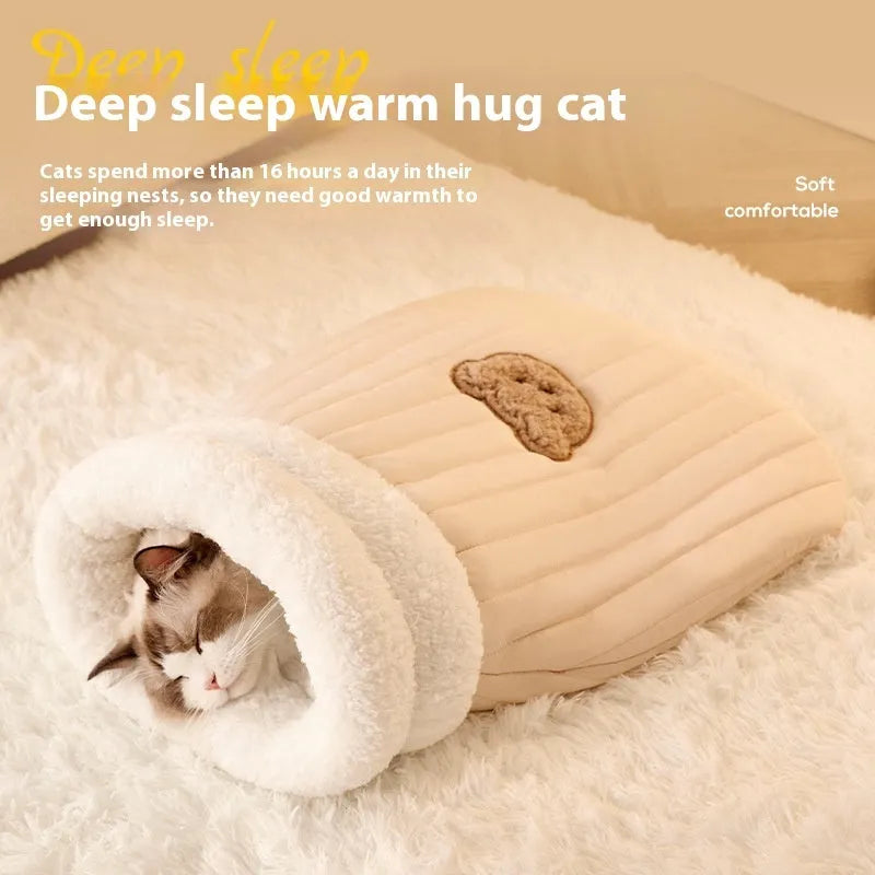 Fleece cat sleeping bag nest in light brown colour with a 3D entrance, shown on a wooden floor.