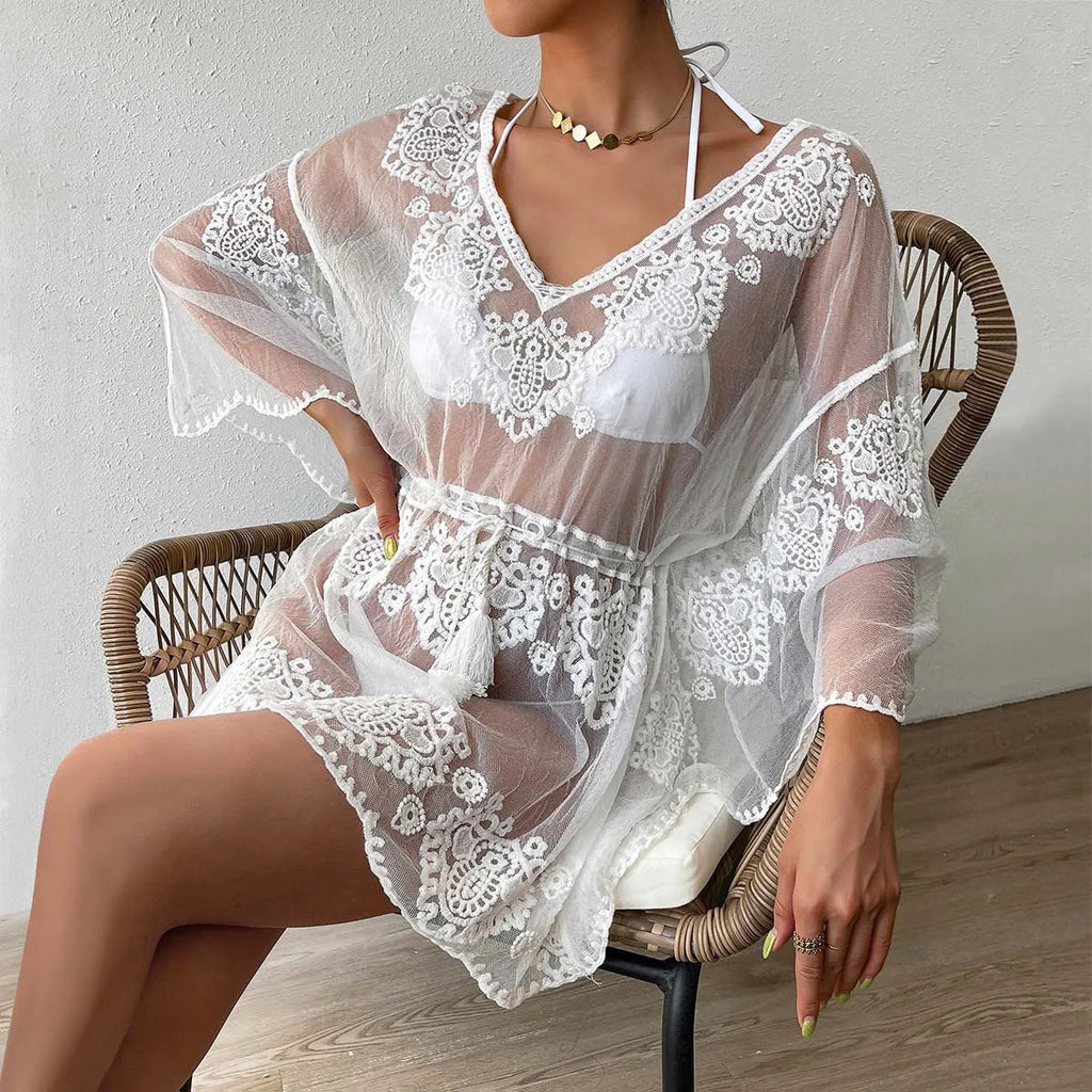 White women's beach blouse shown as swimwear cover-up for sun protection