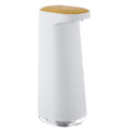 White automatic foam soap dispenser with infrared sensor on a bathroom countertop