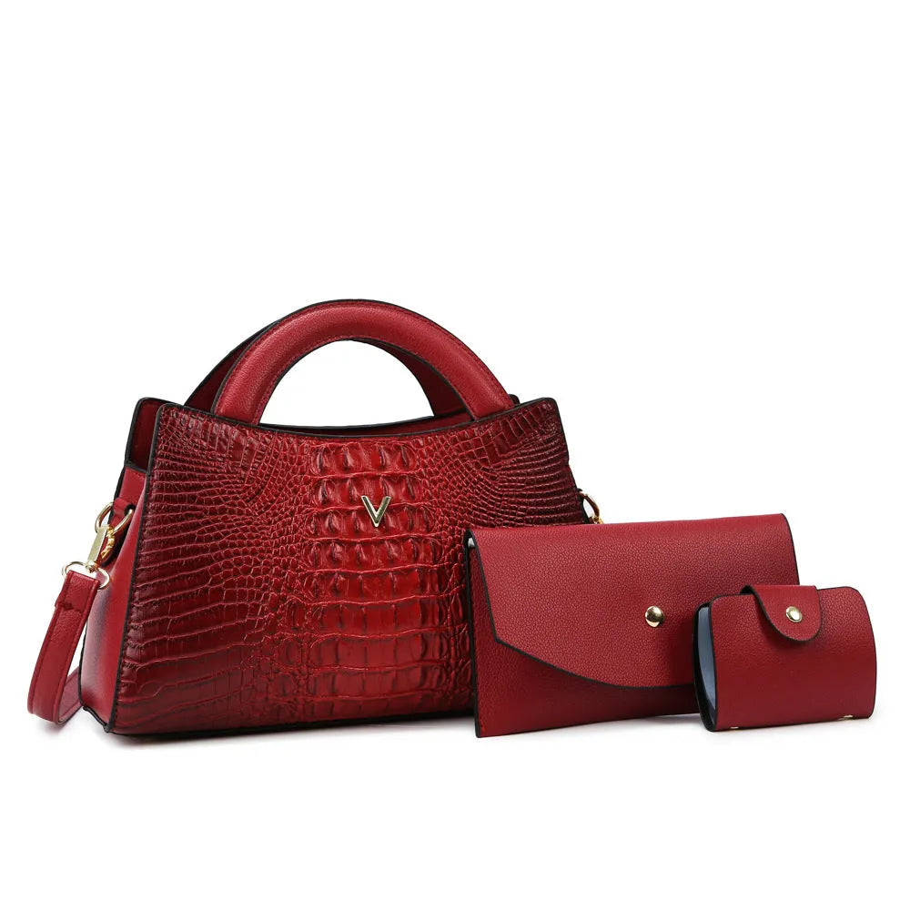 Women's square black crocodile pattern crossbody handbag with visible stitching and a single shoulder strap.