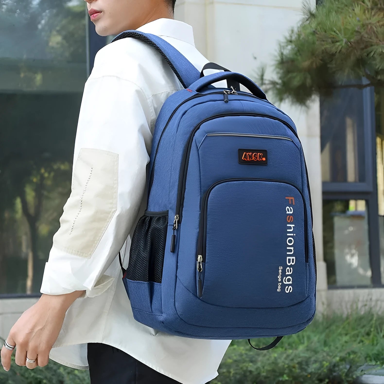Street trend fashion backpack in grey showing double shoulder straps and front zip pocket.