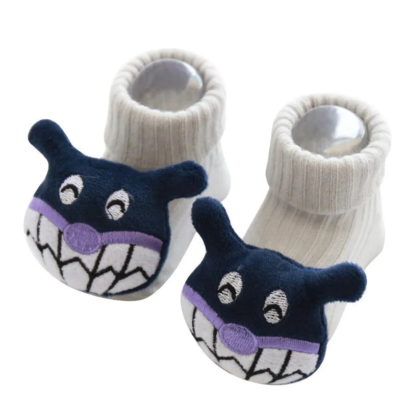 Pair of cotton baby socks in a pink colour with a star print design, shown flat.