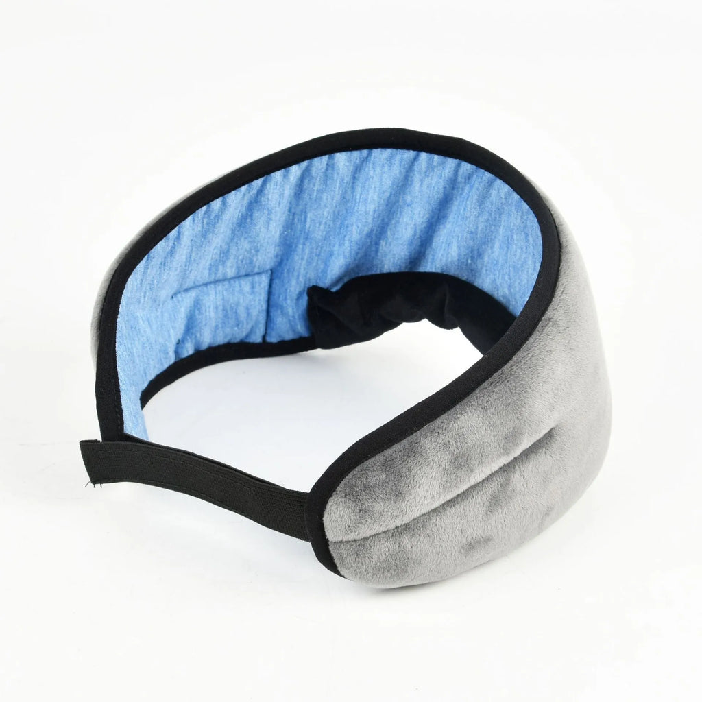 Black sleep eye mask with soft silk fabric, adjustable strap, and carry case on a light background