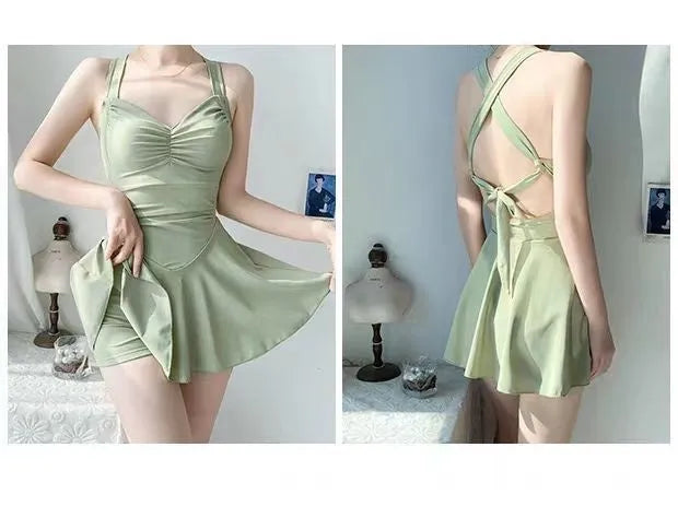 Women's boxer style one-piece swimsuit in backless design with solid colour options
