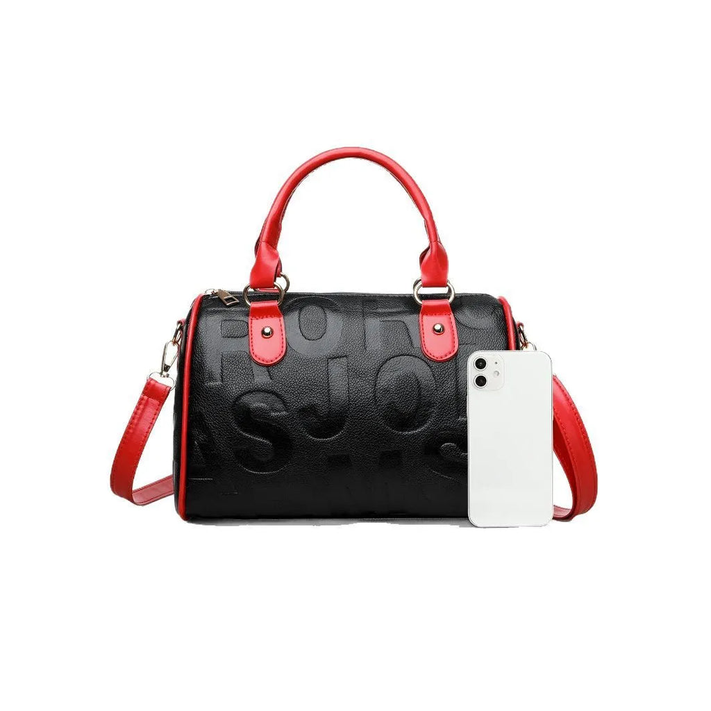 Red cylindrical crossbody bag with three straps and authentic leather tactile feel