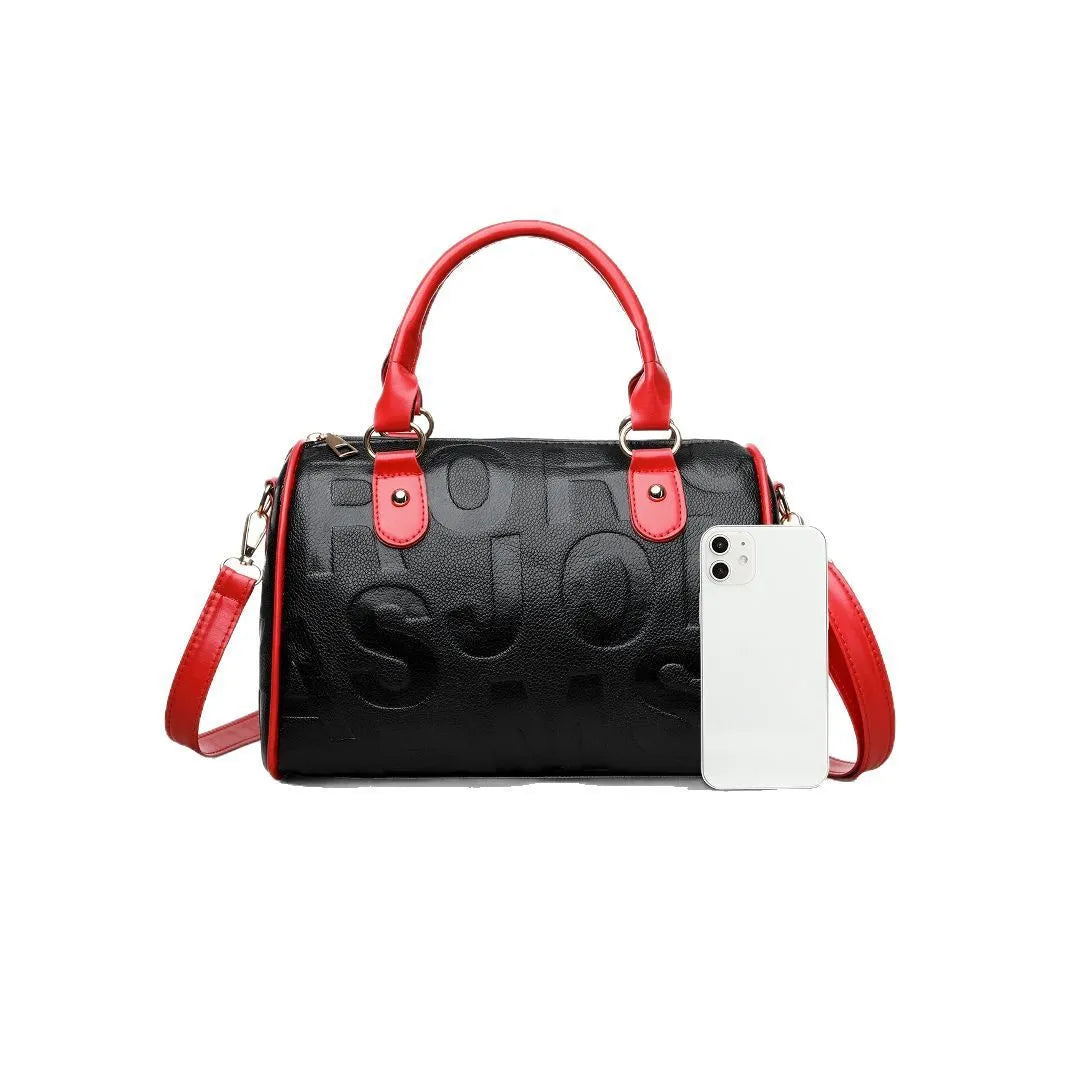 Red cylindrical crossbody bag with three straps and authentic leather tactile feel