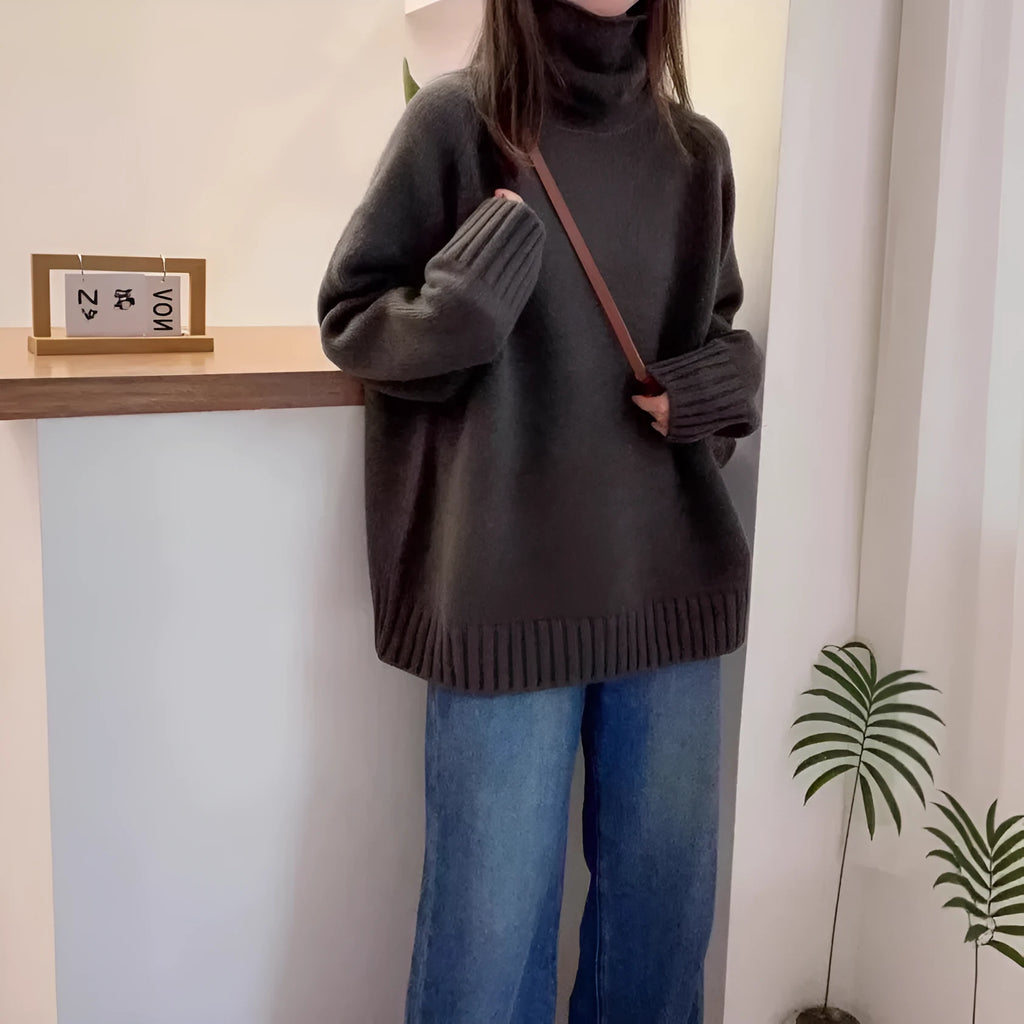 Loose red women's turtleneck sweater with thick curling collar, casual idle style.