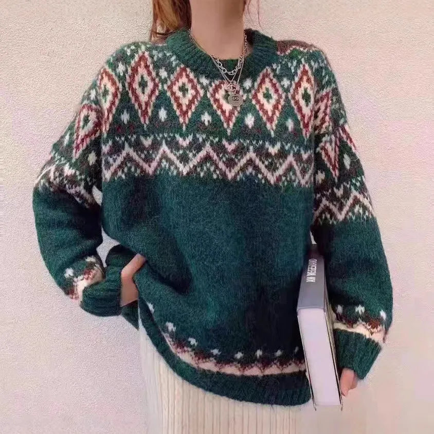 Red and white striped loose-fitting long-sleeved knitted pullover top on a model.