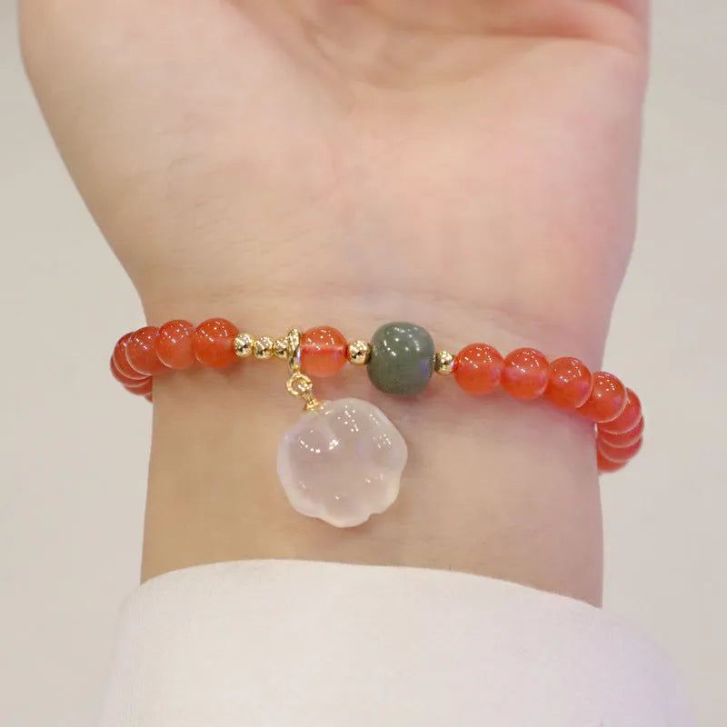 Women's red agate bracelet with 6mm beads and 8mm cat's paw design element