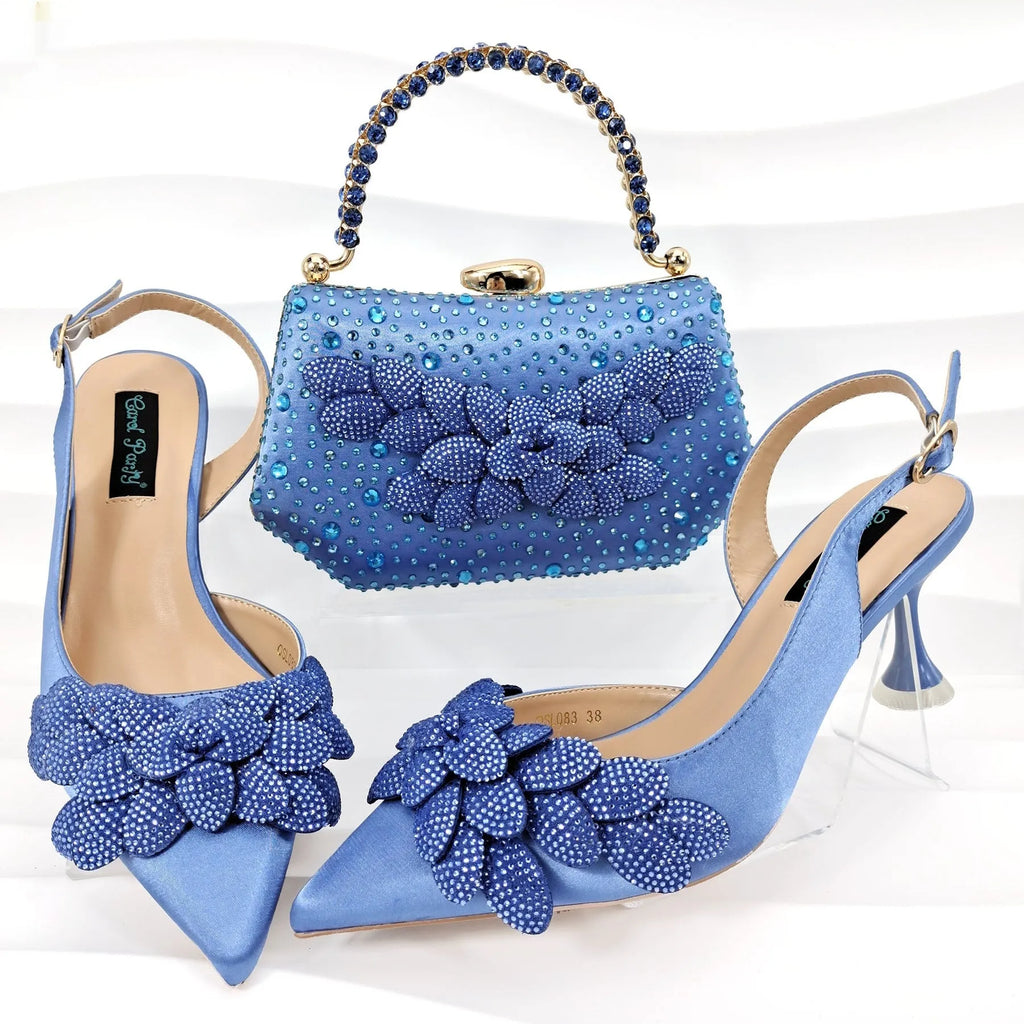 Party shoes and bag set with wine glass heel, rhinestone decoration, and buckle fastening in silver colour