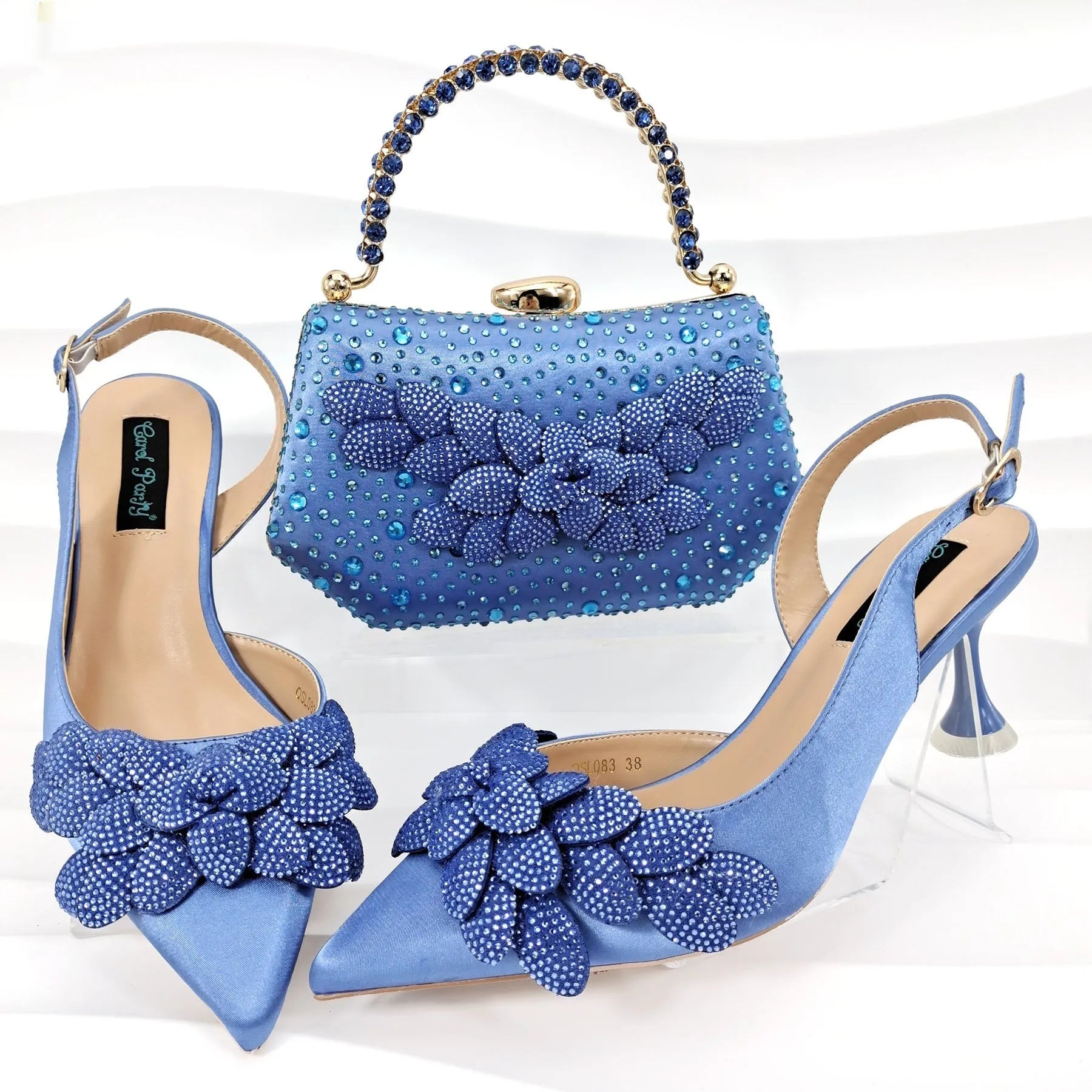 Party shoes and bag set with wine glass heel, rhinestone decoration, and buckle fastening in silver colour