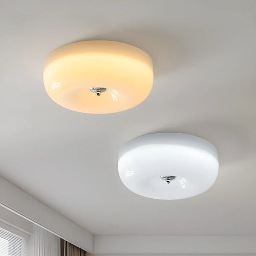 American style cream coloured bedroom ceiling lamp with three-colour light fitting on a white ceiling.