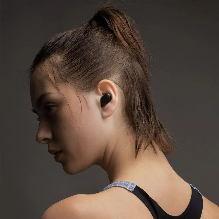 Redmi AirDots 2 black true wireless earphones and charging case on a white background.