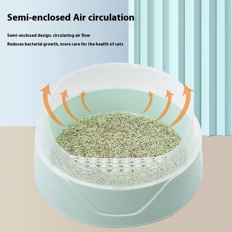 Round enclosed cat litter box in mint green or soft fog pink colours