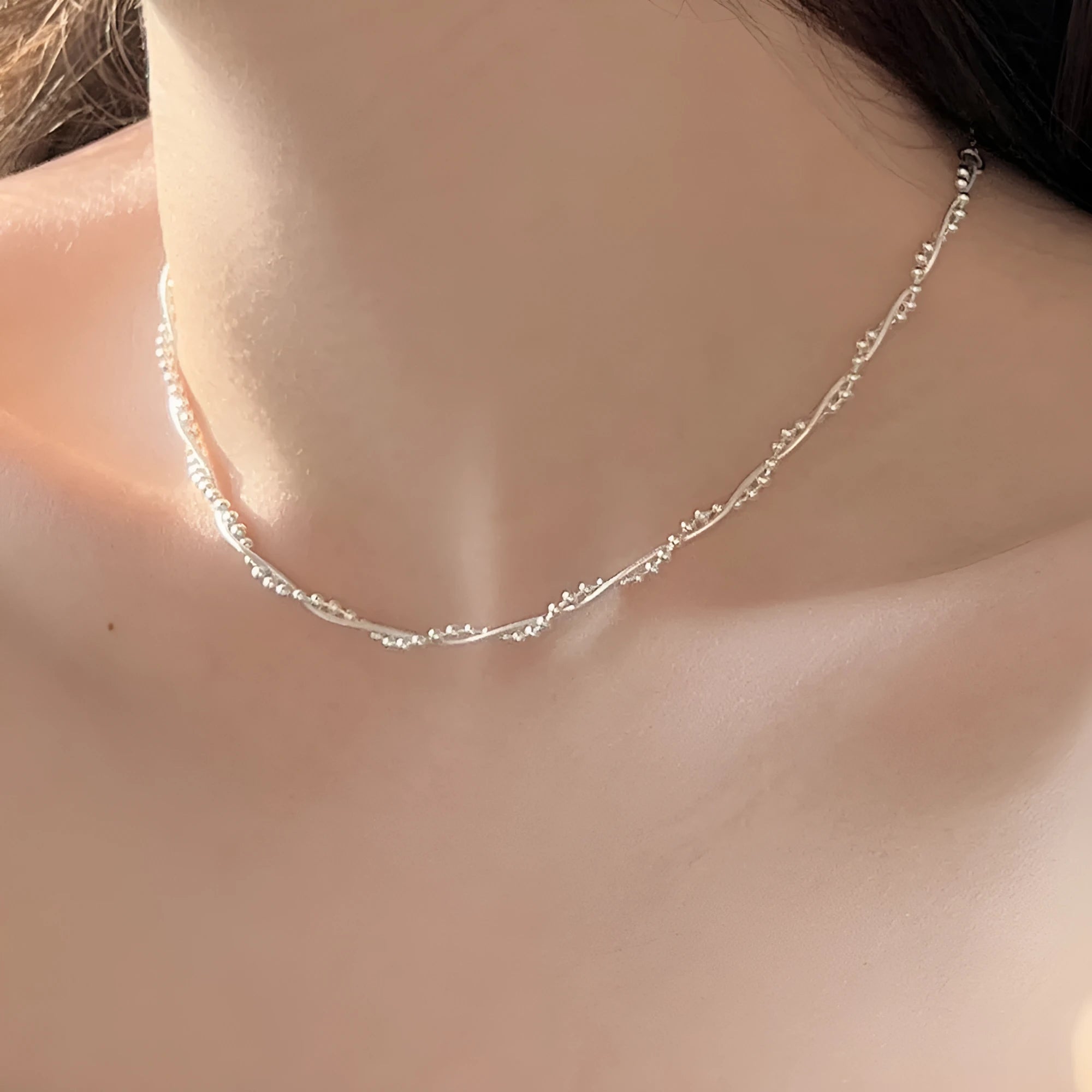 925 sterling silver geometric pendant necklace with electroplated silver finish on woman